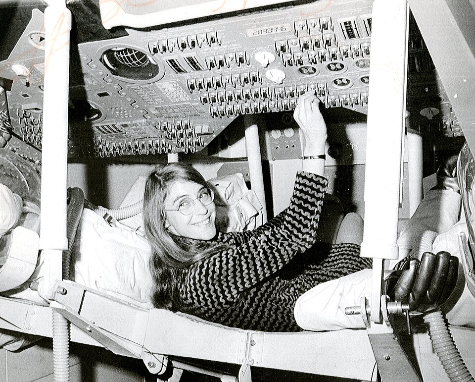 Margaret Hamilton seated inside an Apollo command module mockup, 1969