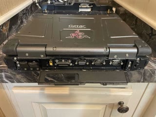 Rear ports: VGA, serial, USB, power — behind sealed doors. Photograph by Rocky L. Oliver.