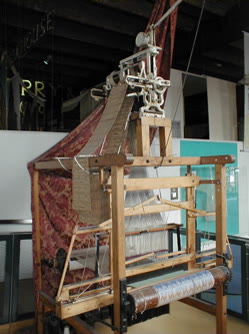 A Jacquard loom at work — the mechanism Lyon's weavers tried to destroy