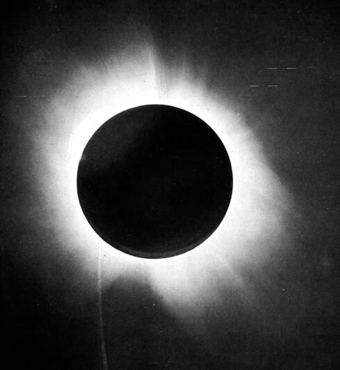 A positive print of one of the 1919 Príncipe eclipse plates — the dots are stars displaced from their true positions by the Sun's bent spacetime, the photograph that made relativity and made Einstein (Dyson/Eddington/Davidson, public domain).