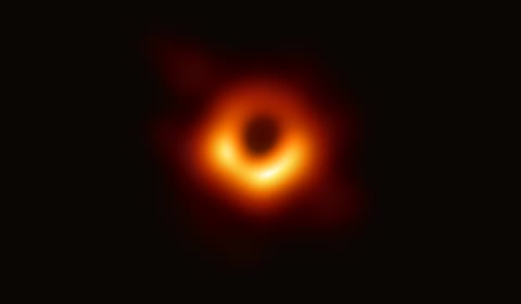 The first photograph of a black hole — M87, 55 million light-years away, the glowing ring of superheated gas around the shadow where spacetime ends (Event Horizon Telescope, CC BY 4.0).
