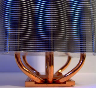 A CPU on its heatsink — the thermal wall made metal. Modern chips sit ~10⁵–10⁷× above the Landauer floor, and the whole industry pays the bill (walknboston, CC BY 2.0).